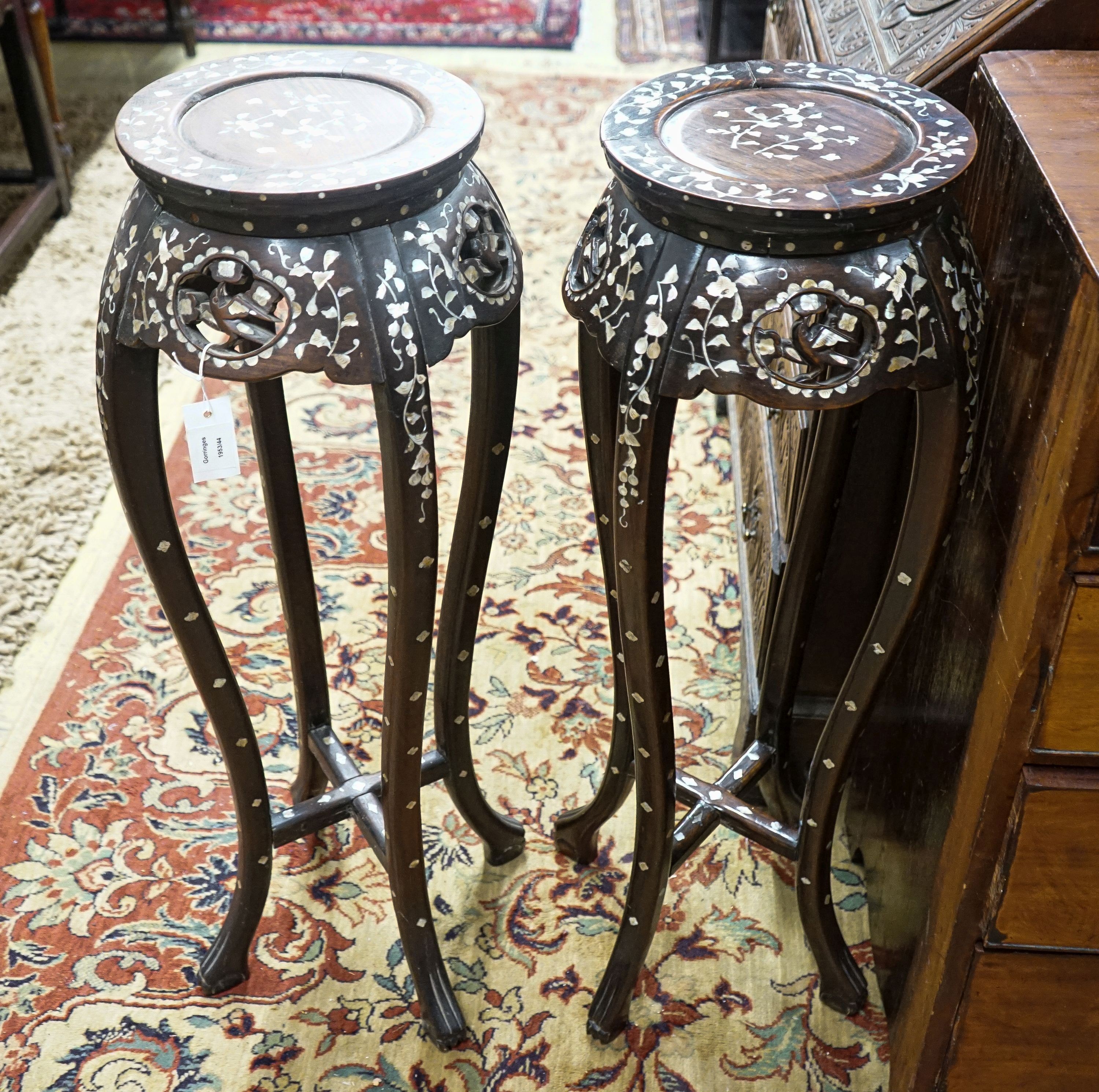 A pair of Chinese mother of pearl inset hardwood vase stands, height 92cm